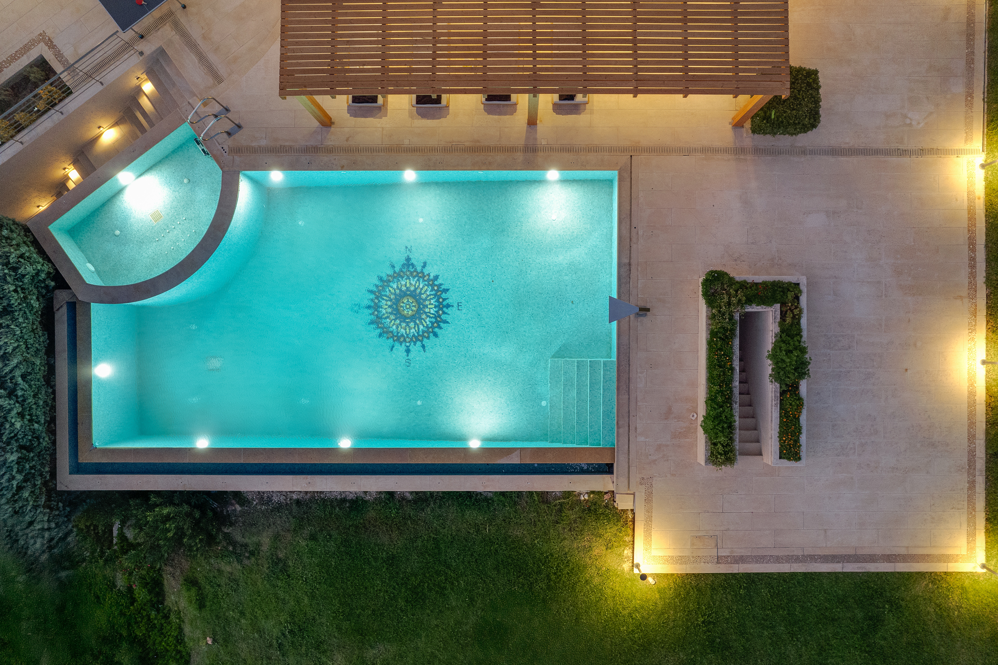 Heated infinity pool and terraces of Villa Lithos Porto Rafti with sea views